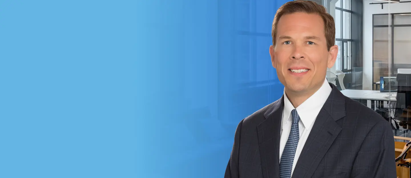 Jeffrey Erxleben, President of Capital markets, on a blue background