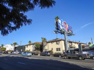 garden apartments with billboard
