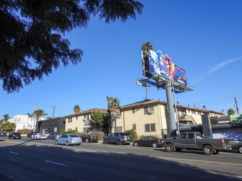 garden apartments with billboard