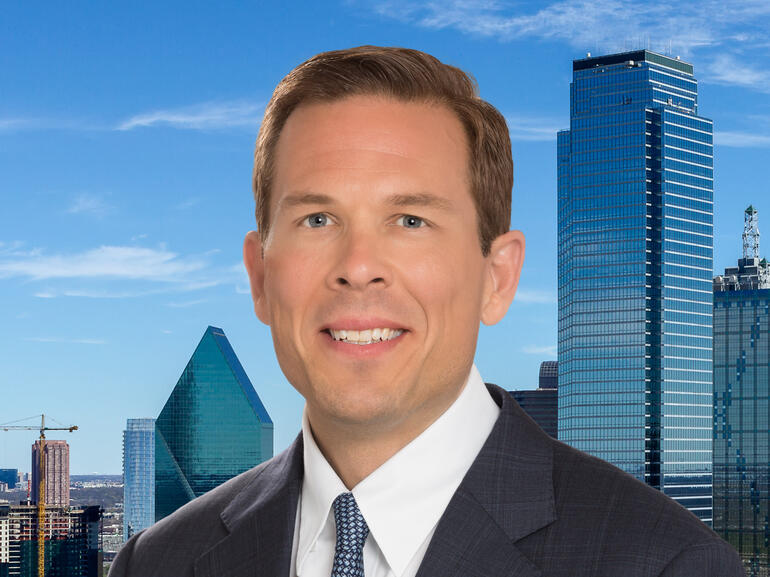 Northmarq's Jeff Erxleben in front of the Dallas, Texas skyline