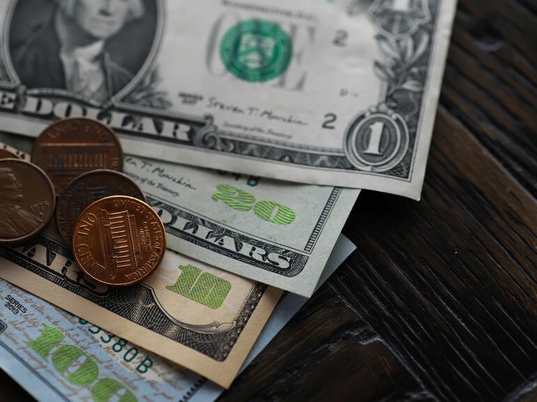 Dollar bills and pennies