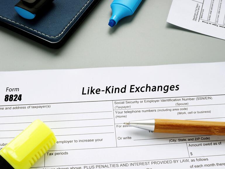 Form 8824 Like-Kind Exchanges phrase on the sheet