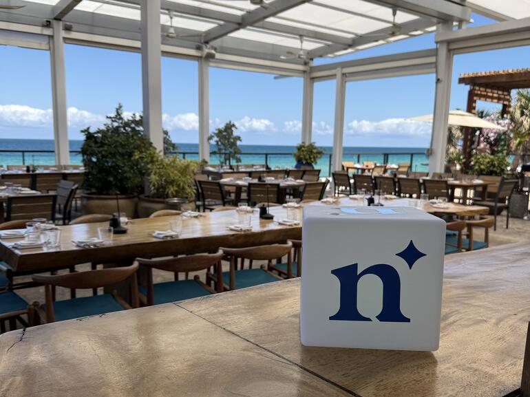 Northmarq logo at servicing and tech conference 2025 MBA