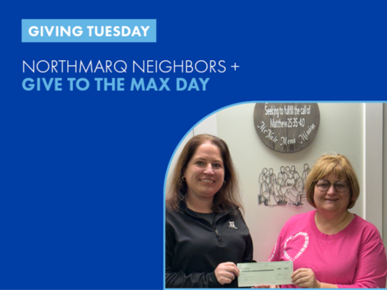 Lanie Beck hands check to charity.