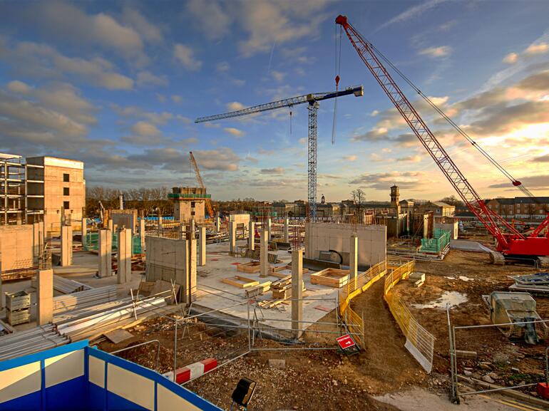 New hospital and healthcare facility under construction with cranes