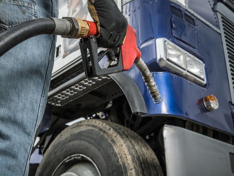 Trucker in Front of His Truck Preparing For Diesel Fueling