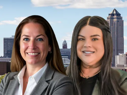 Northmarq's Lanie Beck and Bianca Farrington in front of a downtown skyline