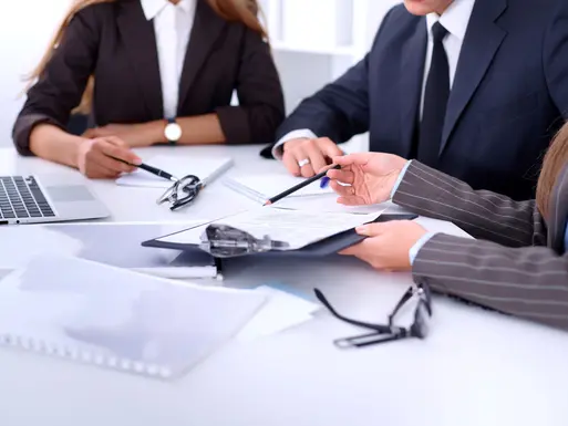 Group of business people at a meeting against the background of the office to discuss a reverse 1031 exchange