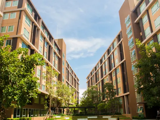 Corridor view between two multi-story off campus student housing apartments