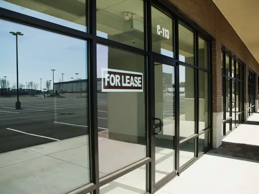 Empty retail storefront with for lease sign